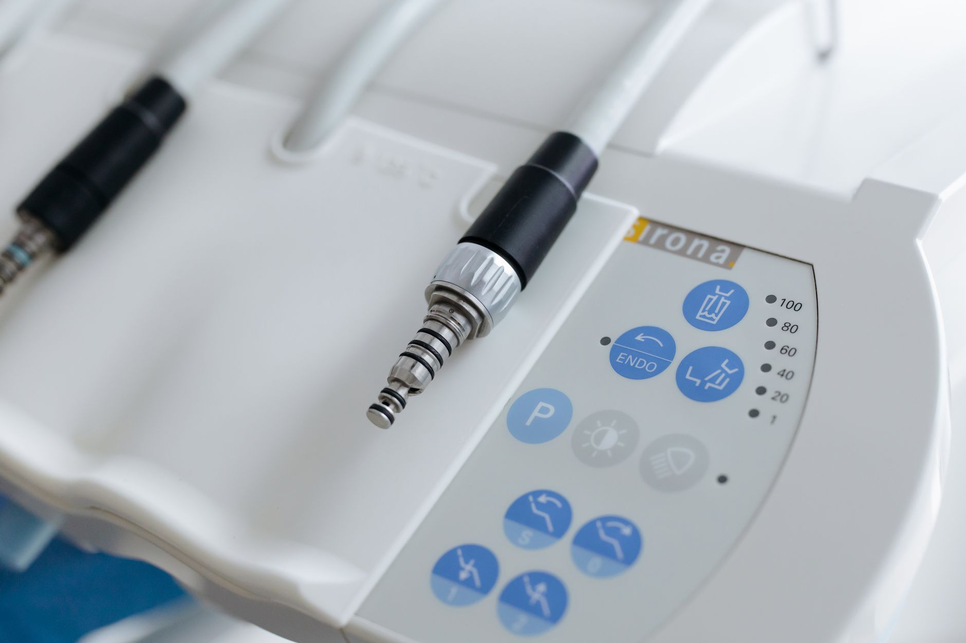 Close view of a dental unit control panel with an endodontic motor setting and handpiece connectors